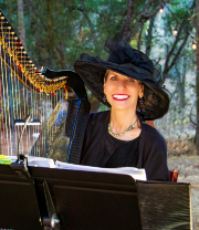 Harpist Anne Roos performing in a forest